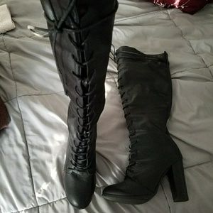 Black knee high boots.